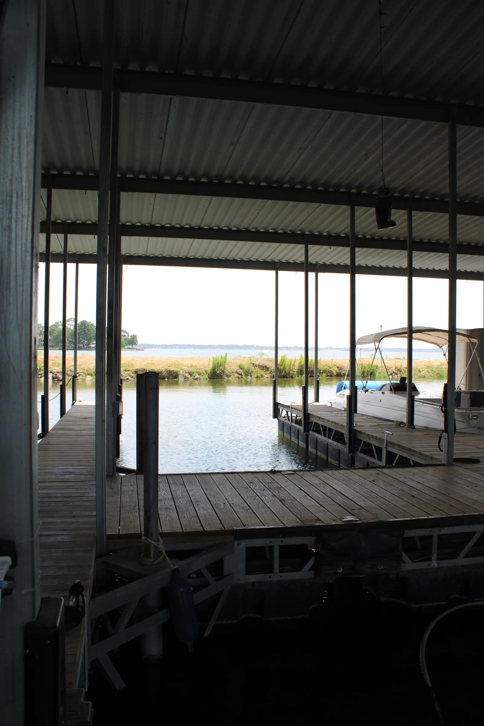 Wide covered walkway running the length of a dock